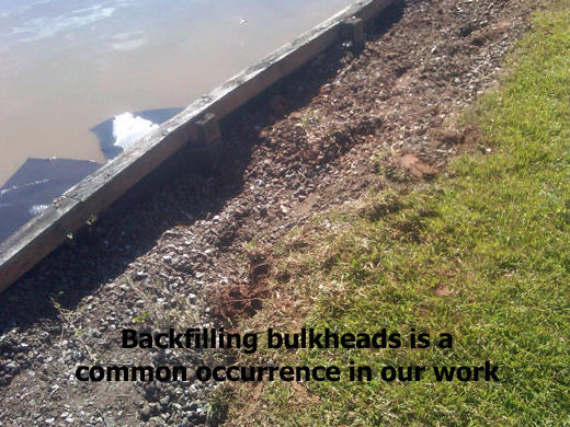 Stabilize bulkhead by filling in huge gaps caused by water erosion