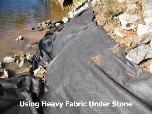 Heavy Fabric Under Stone to Secure Lake Gaston Shorelines